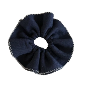 French style dark blue knitted hair scrunchie with grey sawtooth stitching on white background