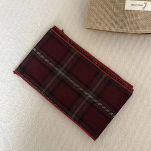 Detail of red and black plaid fabric silk scarf necklace with high-quality stitching
