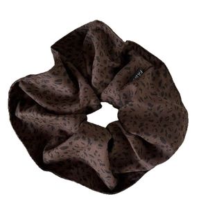 Satin leopard print hair scrunchie in coffee brown featuring a fashion brand label