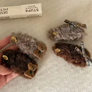 Plush brown bear and plaid bow hair clips with metallic handmade tag for autumn and winter