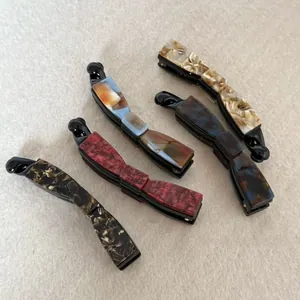 Banana clips set with marble and tortoise shell patterns in various stylish colors