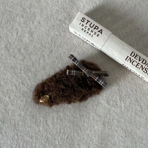 Brown faux shearling teddy bear hair clip with a stylish black and white plaid bow