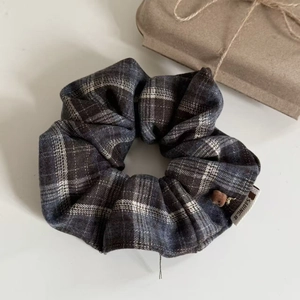 Elegant grey plaid hair scrunchie with cotton-linen texture and brown bead detail