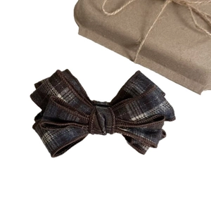 Elegant plaid bow hair clip crafted from premium tweed wool fabric in vintage style