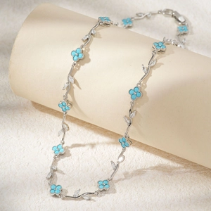 Silver branch necklace with sky blue clover flowers and marquise-cut zircon stones