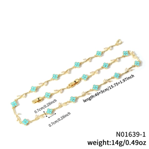Exquisite gold clover necklace with green gemstone charms and sparkling leaf accents
