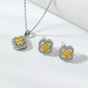 Luxury four-leaf clover jewelry set with yellow zircon pear-shaped stones and white crystals