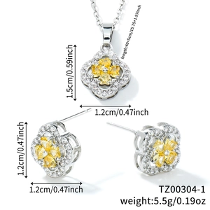 Luxury four-leaf clover jewelry set with yellow zircon pendant and matching stud earrings
