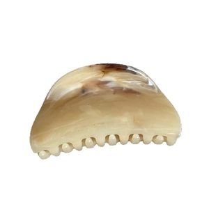 Elegant amber tortoise shell hair claw clip with brown ink marble pattern on white back