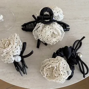 Elegant polka dot hair accessory set with white rose fabric, lace and pearl details