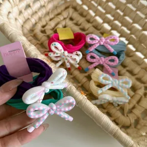 Floral bow hair ties set with colorful striped patterns for girls' ponytails