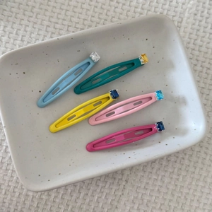 Set of 5 colorful dopamine style sugar cube hair clips with rhinestones on ceramic tray