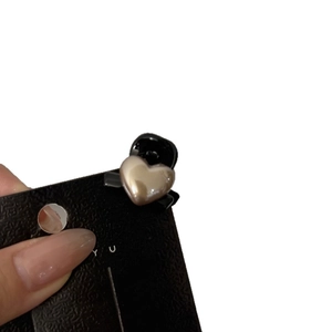 Elegant pearl heart mini hair claw clip for women with golden finish and black grip base
