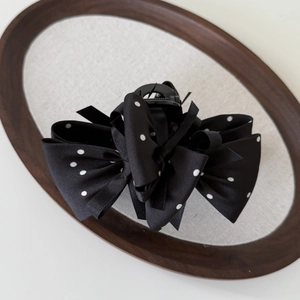 Vintage black and white polka dot bow hair claw clip with multi-layer ribbon design