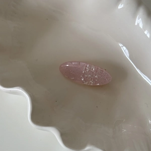 Dreamy pink oval resin hair clip with silver glitter and pearlescent shell fragments