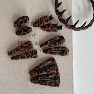 Leopard print hair accessory set with geometric clips and non-slip headband for women