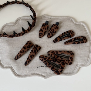 Leopard print hair accessory set with fabric headband and multiple non-slip hair clips