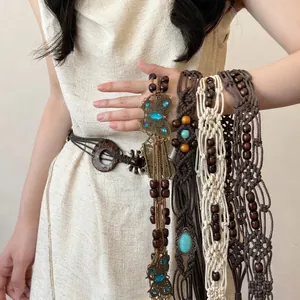 Bohemian beaded waist chain belt featuring butterfly buckles and ethnic woven rope accents
