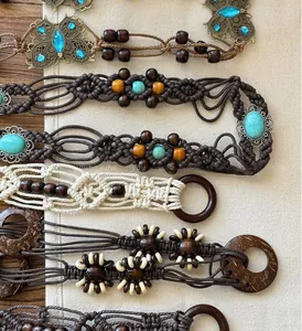 Detail of bohemian braided waist belts with turquoise buckles and wooden beads