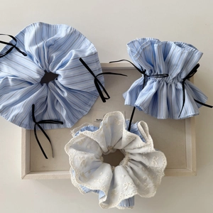 Blue striped ballet bow scrunchie set with lace details and floral fabric texture