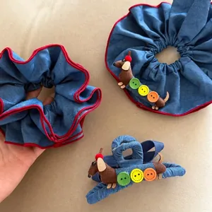 Denim scrunchie and clip set featuring cute dachshund dolls with colorful buttons