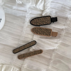 Set of 4 vintage leopard print hair clips with oval and rectangular resin designs