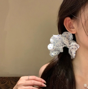 Elegant white scrunchie with blue polka dots made of soft chiffon for ponytail styling
