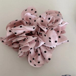 Pink satin scrunchie with black polka dots for women’s ponytails and buns