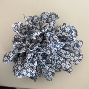 Navy blue scrunchie with white daisy prints for bun or ponytail hair styling