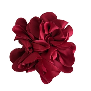 Elegant burgundy layered satin flower hair tie for buns and ponytails on white background