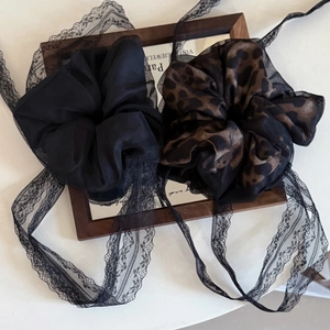 Set of leopard print and black mesh scrunchies with elegant lace streamers for hair