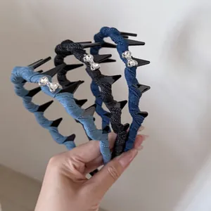 Detail view of denim headbands with rhinestone bows and anti-slip inner teeth