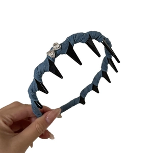 Denim woven headband with rhinestone bow detail on classic black toothed hair hoop
