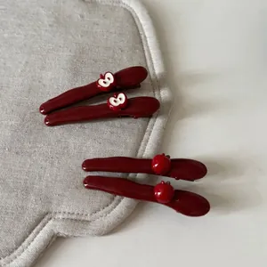 Cute dark red apple hair clips set for women with glossy finish and minimalist design