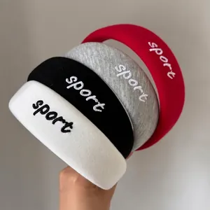 Sporty cotton sponge headbands with letter embroidery in white, black, gray, and red