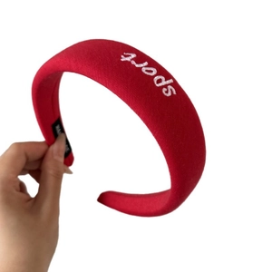 Red padded cotton sponge headband with white sport embroidery and thick knit fabric style
