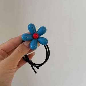Blue flower hair tie with red center and black high elasticity band for women pony tail