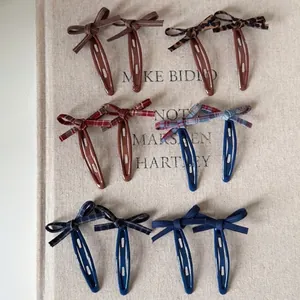 Set of vintage plaid and leopard print bow hair clips for women in various colors