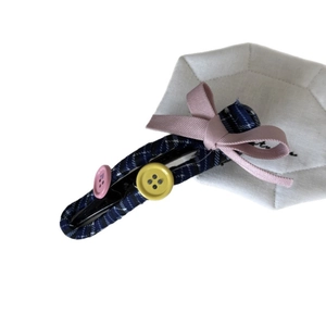 Blue plaid hair clip with pink ribbon bow and buttons on a white background