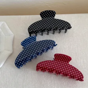 French vintage polka dot hair claw clips in red, blue, and black for elegant updos
