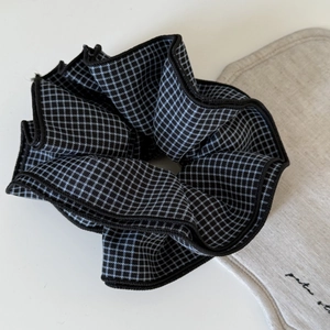 Dark blue checkered oversized scrunchie with double layer ruffles on white background