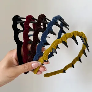 Detailed view of colorful velvet headbands with non-slip teeth in five assorted colors