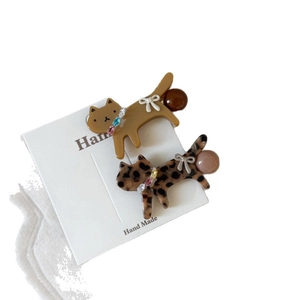 Cute cat-shaped hair clips set with leopard pattern and colorful crystal bow accents