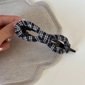 Blue and white plaid bow hair claw clip with black infinity shaped grip for women