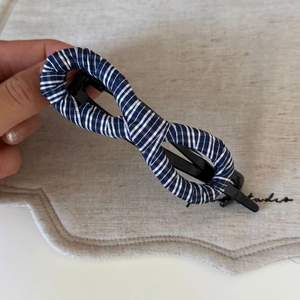 Vintage navy blue striped twisted hair claw clip with elegant infinity figure-eight design