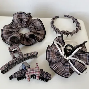 British plaid hair accessory set including scrunchie, headband, and dog detail claw clips