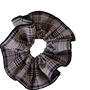 Black and brown checkered plaid hair scrunchie with elegant pleated ruffled edges