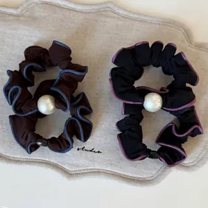 Chiffon scrunchies with contrast edges and large pearl decoration in two colors