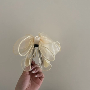 Elegant large cream organza bow hair clip with textured layered design for women