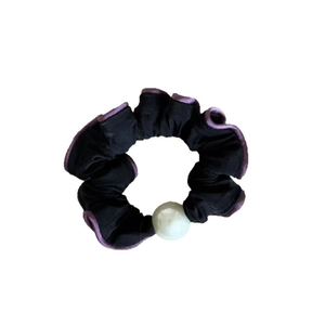 Elegant black scrunchie with purple ruffle trim and a large white pearl accent